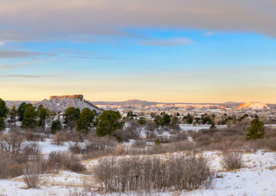 Panoramic Photo of Wave Cloud Over Snowy Castle Rock at Sunrise