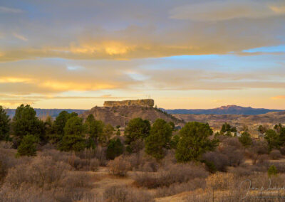 Clouds Painted in Warm Yellow Light at Sunrise over Castle Rock in the Fall