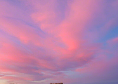 Vertical Photo of Pink Clouds at Dawn over the Castle Rock Star