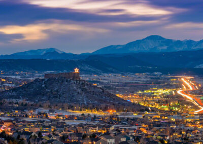 Sunset Photo of Snow Covered Pikes Peak with Illuminated Castle Rock Star Jan 2020