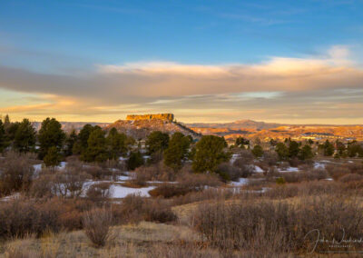 Warm Colors of Sunrise in Photo of Winter Scene of Castle Rock CO