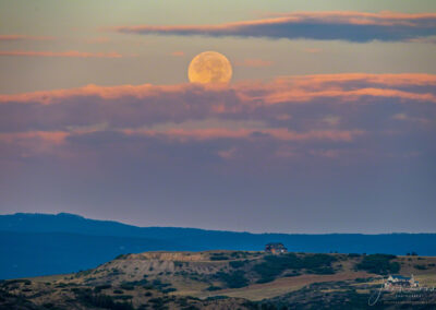 Purple Pink Sunrise with Full Moon over Devils Head with Home in Foreground