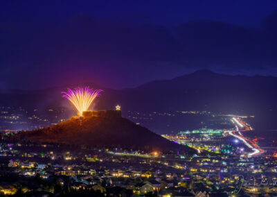 A Burst of Violet and Gold Fireworks over Castle Rock CO During Starlighting Ceremony